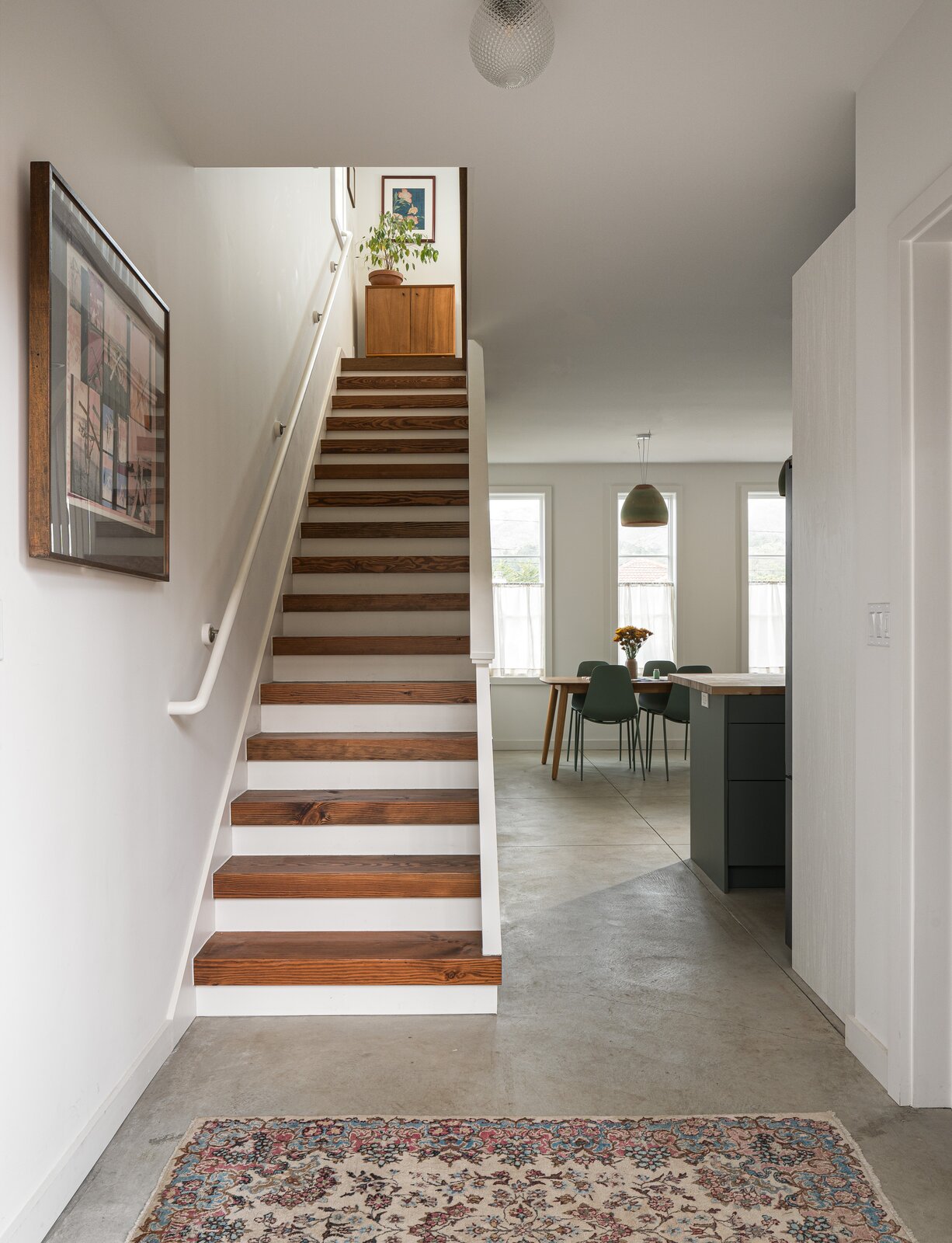 Concrete ground-floor flooring gives way to Douglas fir stairway treads.