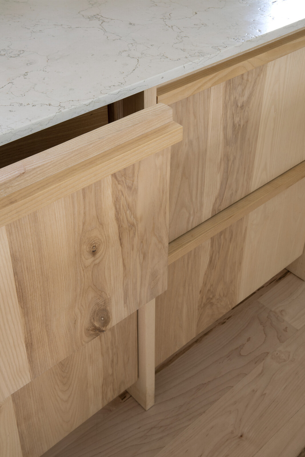 The custom ash cabinets by Material are not just wood veneer but solid wood.