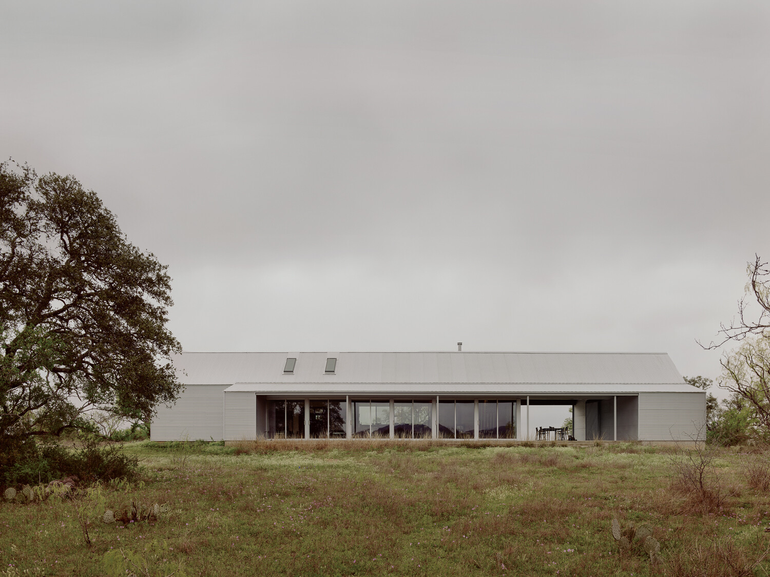 Though the house's design was inspired by old sheds and barns, its glass walls give the home a contemporary feel and fill the interior with light, even on cloudy days.