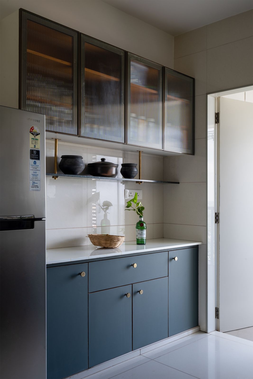 The open kitchen is a frequent gathering and social space, whether for the family of four or when entertaining.