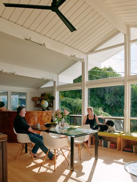 The renovated house uses its void ceiling and a newly decent plan for creating a large primary room for Brandon, Kati, Scout and Children.