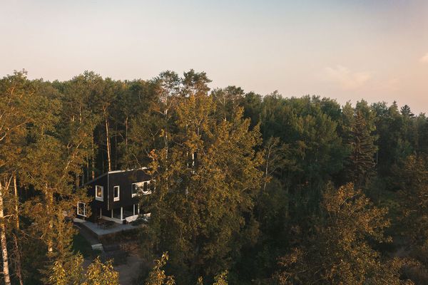 Mike and Elaine's Wabamun Lake cabin, just 45 minutes from their Edmonton home, is nestled in a wooded setting just steps from the water.