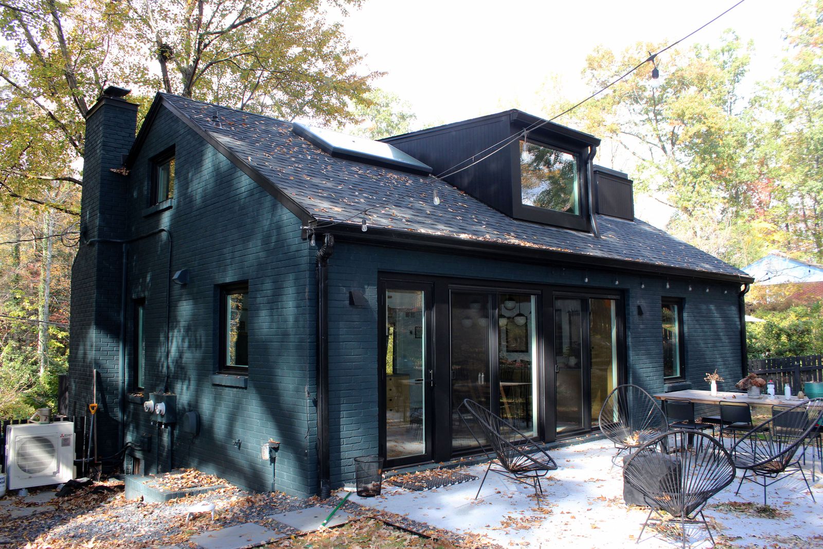 The renovation added two sliding-glass doors and a new concrete patio.
