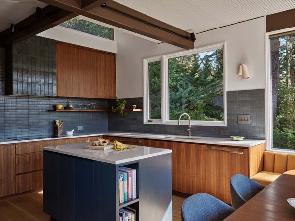 After 10 years of living in this post-and-beam house designed by celebrated local architect John Storrs, Jeff and Todd knew they wanted a renovation to focus on opening up the kitchen.