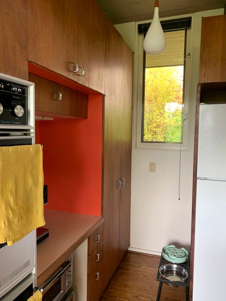 In the cramped kitchen, even some cupboards were hard to access without bumping into the fridge or knocking over the dog bowls.