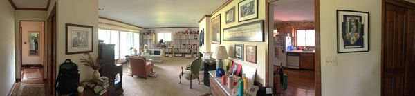 As seen in this panoramic photo, originally the kitchen was separated from the living room by a wall.