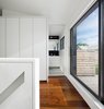 Modern home with Hallway and Medium Hardwood Floor. The marriage of interior and exterior, combined with meticulously conceived details and a restricted material palette, provide a continuous thematic quality throughout the project. Photo 10 of Contrast House