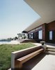 Modern home with Exterior, Metal Roof Material, Stucco Siding Material, Butterfly RoofLine, House Building Type, and Wood Siding Material. Ridge House Photo of Ridge House