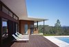 Modern home with Outdoor, Concrete Pools, Tubs, Shower, Back Yard, Large Patio, Porch, Deck, Large Pools, Tubs, Shower, Horizontal Fences, Wall, Hardscapes, Swimming Pools, Tubs, Shower, Grass, Decking Patio, Porch, Deck, Wood Patio, Porch, Deck, Concrete Fences, Wall, Trees, Landscape Lighting, and Retaining Fences, Wall. Ridge House Photo 2 of Ridge House