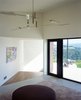 Modern home with Hallway, Concrete Floor, and Medium Hardwood Floor. Ridge House Photo 5 of Ridge House