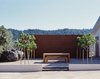 Modern home with Outdoor, Horizontal Fences, Wall, Concrete Fences, Wall, Boulders, Decomposed Granite Patio, Porch, Deck, Wood Fences, Wall, Trees, Landscape Lighting, Shrubs, Front Yard, and Hardscapes. Ridge House Photo 11 of Ridge House