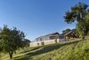 Modern home with Exterior, Gable RoofLine, Metal Roof Material, Wood Siding Material, Farmhouse Building Type, and House Building Type. Orchard House Rear Photo 4 of Orchard House