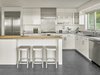 Modern home with Kitchen, White Cabinet, Cooktops, Engineered Quartz Counter, Range Hood, Recessed Lighting, Refrigerator, Dishwasher, Ceramic Tile Floor, Wine Cooler, Undermount Sink, and Ceiling Lighting. Orchard House Interior Photo 8 of Orchard House