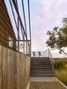 Modern home with Outdoor, Large Patio, Porch, Deck, Landscape Lighting, Trees, Grass, Back Yard, Wood Patio, Porch, Deck, Hardscapes, Decomposed Granite Patio, Porch, Deck, Walkways, and Vertical Fences, Wall. Orchard House Exterior Photo 12 of Orchard House