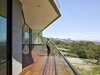 Modern home with Exterior, Flat RoofLine, House Building Type, and Wood Siding Material. Front deck Photo 5 of Box on the Rock