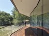 Modern home with Exterior, Wood Siding Material, Flat RoofLine, and House Building Type. Front deck Photo 6 of Box on the Rock