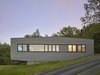 Modern home with Exterior, Wood Siding Material, and House Building Type. Side Elevation Photo 7 of Box on the Rock