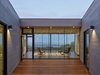 Modern home with Exterior, Flat RoofLine, House Building Type, and Wood Siding Material. Entry Court Photo 8 of Box on the Rock