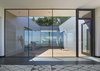 Looking back towards entry through courtyard. Photo 11 of Box on the Rock modern home