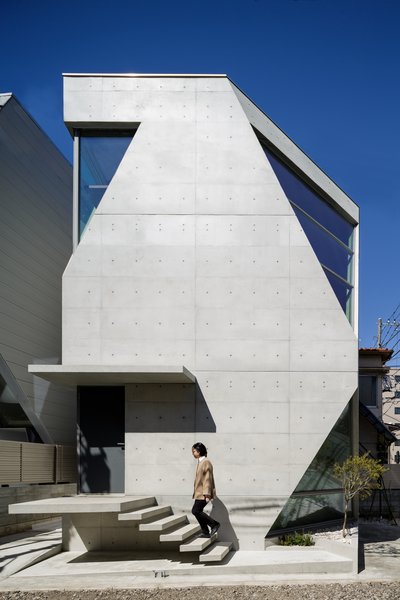 Built with specially-formulated concrete made of volcanic ash, this micro-house in Tokyo maximizes space through vertical construction. 
When Tokyo-based architecture firm Atelier TEKUTO received a brief from their clients to build a distinctive, environmentally-conscious concrete home, they embarked on a two-and-a-half year journey of spacial and material exploration. Built in 2015, the result—the R Torso C project—recently won the Overall Excellence Award and first place in the low-rise buildings category at the 2017 American Concrete Institute Awards.