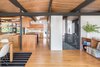Modern home with Hallway and Medium Hardwood Floor. The new living room/dining room space is bright and airy compared to the previous dark and outdated state. Photo 6 of Hillside Midcentury
