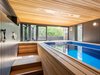 "The property does not have a conventional backyard, so the pool is a place where the adults can get some exercise, and the two young children can play. From here, the evening sun streams through the slide-fold doors, creating a lovely ambiance," Schaer explains.
Photo 13 of Hillside Midcentury modern home