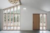 Modern home with Windows, Casement Window Type, and Wood. The unique window arrangement floors the space with light and improves the flow of air through the space. Photo 6 of Stable Conversion