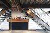 Modern home with Staircase, Metal Railing, and Metal Tread. Under the stairs, the steel base board was replaced with steel plate to create a durable storage space for bikes. Photo 4 of Capitol Hill Loft