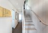 Modern home with Bed, Night Stands, Table, White Cabinet, Ceramic Tile Backsplashe, Sofa, Coffee Tables, End Tables, Porcelain Tile Floor, Pendant Lighting, Refrigerator, Cooktops, Undermount Sink, Wood Railing, Metal Railing, Wood Tread, Porcelain Tile Wall, Cable Railing, Open Shower, and Two Piece Toilet. Stairs Photo 10 of Tahoe Lakefront