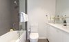Modern home with Table, Night Stands, Bed, Ceramic Tile Backsplashe, Sofa, White Cabinet, Coffee Tables, End Tables, Bar, Wood Tread, Wood Railing, Porcelain Tile Wall, Metal Railing, Cable Railing, Carpet Floor, and Bath Room. Guest Bath Photo 16 of Tahoe Lakefront