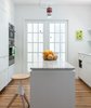 Modern home with Marble Counter, White Cabinet, Light Hardwood Floor, Stone Slab Backsplashe, Ceiling Lighting, Recessed Lighting, Pendant Lighting, Refrigerator, Wall Oven, Cooktops, Kitchen, Undermount Sink, Range Hood, and Dishwasher. Kitchen Photo 2 of Jensen