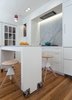 Modern home with Marble Counter, White Cabinet, Light Hardwood Floor, Stone Slab Backsplashe, Ceiling Lighting, Recessed Lighting, Pendant Lighting, Refrigerator, Wall Oven, Range Hood, Undermount Sink, and Kitchen. Kitchen Photo 3 of Jensen