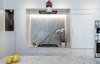 Modern home with Marble Counter, White Cabinet, Stone Slab Backsplashe, Ceiling Lighting, Wall Oven, Light Hardwood Floor, Recessed Lighting, Refrigerator, Pendant Lighting, Kitchen, Range Hood, and Undermount Sink. Kitchen Photo 4 of Jensen