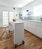 Modern home with White Cabinet, Light Hardwood Floor, Stone Slab Backsplashe, Marble Counter, Pendant Lighting, Ceiling Lighting, Recessed Lighting, Refrigerator, Wall Oven, Undermount Sink, Range Hood, and Kitchen. Kitchen Photo 5 of Jensen