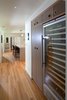 Modern home with Pendant Lighting, Light Hardwood Floor, Recessed Lighting, Refrigerator, Dishwasher, Wine Cooler, and Kitchen. Kitchen Photo 4 of Birchwood
