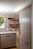 Modern home with Wood Cabinet, Engineered Quartz Counter, Refrigerator, Light Hardwood Floor, Ceramic Tile Backsplashe, and Kitchen. Kitchen Photo 5 of Birchwood