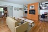 Modern home with Engineered Quartz Counter, Light Hardwood Floor, Wood Cabinet, Ceramic Tile Backsplashe, Colorful Cabinet, Recessed Lighting, Refrigerator, Wall Oven, Cooktops, Range Hood, Undermount Sink, Wine Cooler, Dishwasher, and Living Room. Family Photo 6 of Birchwood