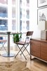 Modern home with Chair, End Tables, Limestone Floor, Wall Lighting, Alcove Tub, Coffee Tables, Sofa, Marble Counter, Open Shower, Dining Room, Stone Tile Wall, and Two Piece Toilet. Dining Photo 5 of Tower Condo