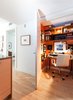 Modern home with Chair, Alcove Tub, End Tables, Coffee Tables, Sofa, Marble Counter, Open Shower, Stone Tile Wall, Table, Office, Two Piece Toilet, and Medium Hardwood Floor. Office Photo 6 of Tower Condo