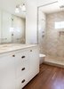 Modern home with Marble Counter, Ceramic Tile Wall, Medium Hardwood Floor, Two Piece Toilet, Wall Lighting, Undermount Sink, Bath Room, and Enclosed Shower. Master Photo 7 of 7th Avenue