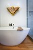 Modern home with Wood Counter, Medium Hardwood Floor, Vessel Sink, Enclosed Shower, Ceiling Lighting, Recessed Lighting, Freestanding Tub, Corner Shower, One Piece Toilet, Wall Lighting, Ceramic Tile Wall, and Bath Room. Master Photo 2 of South Land Park