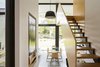 Modern home with Staircase, Wood Tread, and Wood Railing. A stair element extends the circulation condition at the end of the hall where the front cellular rooms expand into new rear interior spaces Photo 6 of Binary House