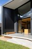 Modern home with Exterior, Metal Roof Material, House Building Type, and Metal Siding Material. A large blade screen provides privacy to the rear terrace from an adjacent neighbour Photo 15 of Binary House