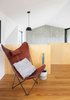 Modern home with Living Room, Chair, and Pendant Lighting. An upper floor interior view at one of the pavilion towards the double-height living area at the other end Photo 18 of Binary House