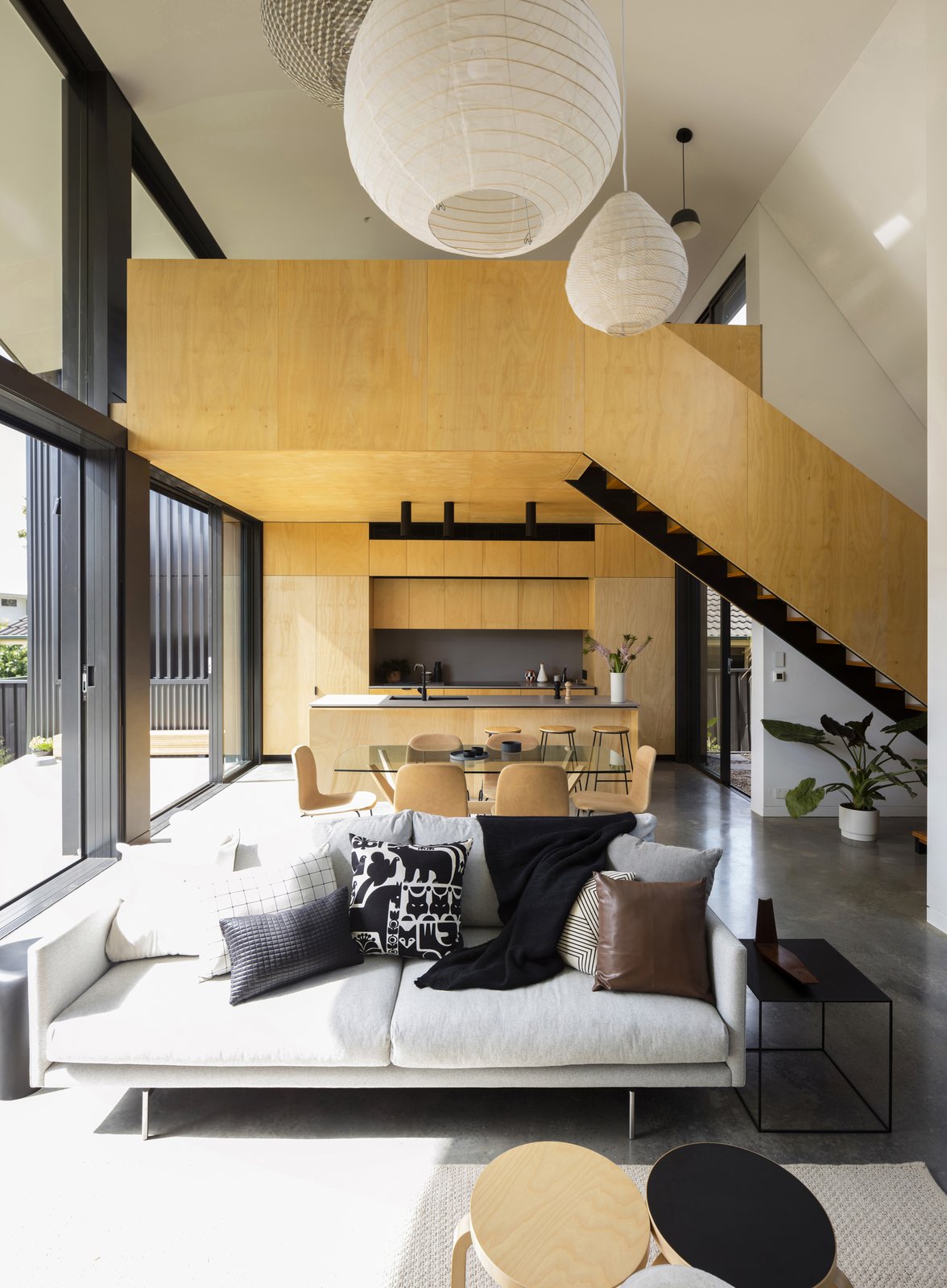 Living areas with two smaller rooms crafted at one end of the pavilion volume - a ground level kitchen and an upper floor sitting room which is flexibly adapted for use as a bedroom and study