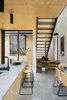 Modern home with Kitchen, Wood Cabinet, Engineered Quartz Counter, Concrete Floor, Ceiling Lighting, and Undermount Sink. A secondary entry from the northern courtyard into the kitchen with sightlines enabled via an open riser stair across the link towards the front dwelling Photo 16 of Binary House