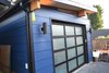 Modern home with Shed & Studio, Storage Space Room Type, and Living Space Room Type. The Modern-Shed Garage, featuring a frosted glass door from Northwest Door.
Photo of Modern-Shed | Garage Solution