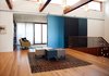 The DECA Architecture team designed a central gallery that connects the main stairwell entry to the dining room and living room. Photo of The CYRK Building modern home