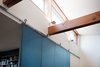 The moveable wall also serves as a door to the library. Photo 3 of The CYRK Building modern home