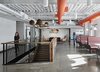 A grouping of Niche and Graypants pendants hangs above a stairwell, leading employees and guests from one floor to another. Do you have Niche lighting in your office? Send us your project information and awe-inspiring images for a chance to be featured on our blog and social media pages. Photo of HubSpot Offices modern home
